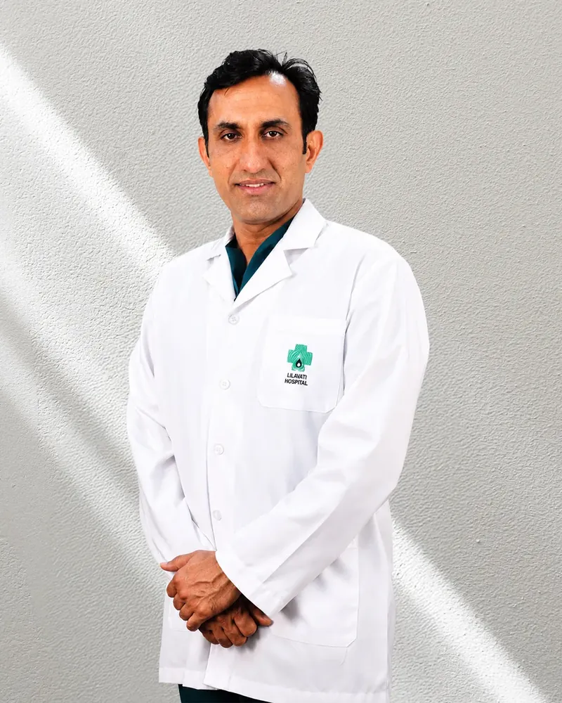 Dr. Ravinder Singh Rao in a white doctor’s coat